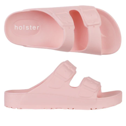 Pink slide sandals with 'holster' branding on a white background